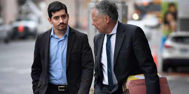 Former State Rep. Michael DiMassa, left, arrives at U.S. District Court in Hartford with his attorney John Gulash on Nov. 1, 2022. DiMassa is accused of stealing federal COVID relief money by billing the city of West Haven, where he also worked as an aide to the City Council, for pandemic-related consulting services that federal officials said he never performed. 