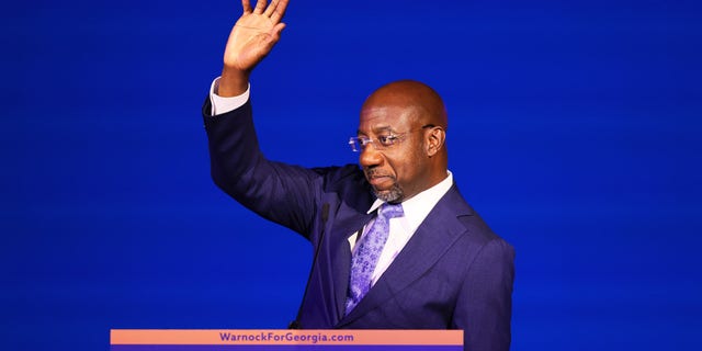 Sen. Raphael Warnock, D-Ga., waves after giving a speech at his Election night party at Atlanta Marriott Marquis on November 08, 2022 in Atlanta, Georgia.