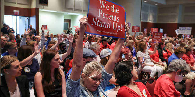 Parents and community members attend a Loudoun County, Virginia, school board meeting on June 22, 2021.