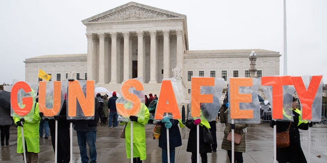 Supporters of gun control and firearm safety measures hold a protest rally outside the US Supreme Court as the Court hears oral arguments in State Rifle and Pistol v. City of New York, NY, in Washington, DC, December 2, 2019. - The case marks the first time in nearly 10 years that the Supreme Court has heard a Second Amendment gun ownership case. (Photo by SAUL LOEB / AFP) (Photo by SAUL LOEB/AFP via Getty Images)