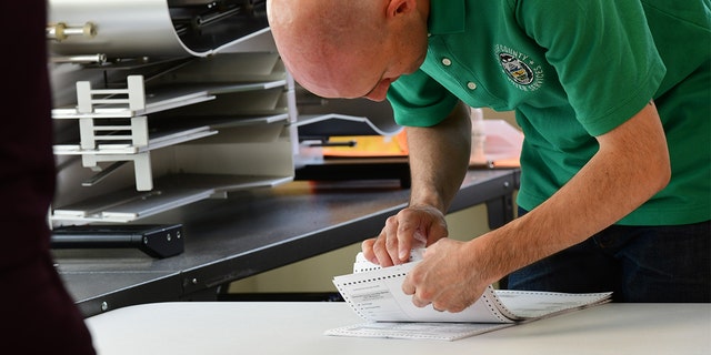 County officials perform a ballot recount on June 2, 2022, in West Chester, Pennsylvania. 