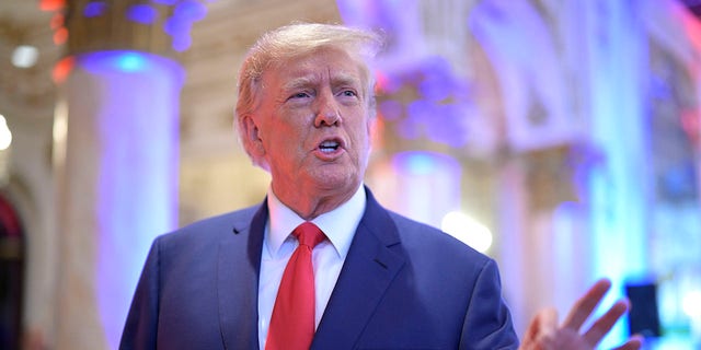 Former President Donald Trump answers questions from reporters during an election night party at Mar-a-Lago, Tuesday, November 8, 2022 in Palm Beach, Florida.