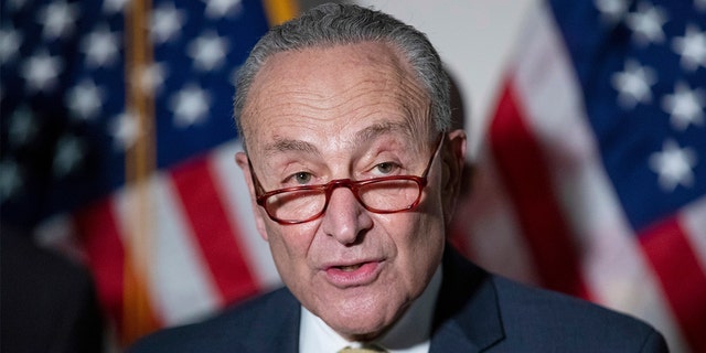 Senate Majority Leader Chuck Schumer, D-N.Y., responds to questions from reporters during a press conference regarding the Democratic party's shift to focus on voting rights at the Capitol in Washington, Tuesday, Jan. 18, 2022.