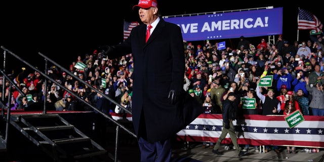 Former President Trump greets supporters before speaking at a rally, Thursday, Nov. 3, 2022, in Sioux City, Iowa.