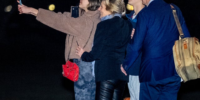 President Biden, first lady Jill Biden, and their grandchildren Natalie and Robert, take a selfie before boarding Marine One on the South Lawn of the White House in Washington, Tuesday, Dec. 27, 2022, for a short trip to Andrews Air Force Base, Maryland, and then on to St. Croix, U.S. Virgin Islands. 