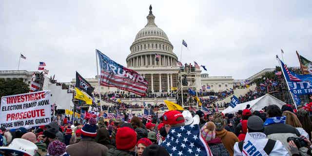 Rioters loyal to then-President Trump rally at the U.S. Capitol in Washington on Jan. 6, 2021. One rioter, Dustin Byron Thompson, was sentenced to three years in prison for his role in the attack