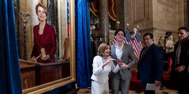 Speaker of the House Nancy Pelosi, D-Calif., is joined by her family as they attend her portrait unveiling ceremony in Statuary Hall at the Capitol in Washington, Wednesday, Dec. 14, 2022. 