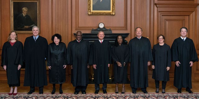 Members of the Supreme Court (L-R) Associate Justices Amy Coney Barrett, Neil M. Gorsuch, Sonia Sotomayor, and Clarence Thomas, Chief Justice John G. Roberts, Jr., and Associate Justices Ketanji Brown Jackson, Samuel A. Alito, Jr., Elena Kagan, and Brett M. Kavanaugh pose in the Justices Conference Room prior to the formal investiture ceremony of Associate Justice Ketanji Brown Jackson September 30, 2022 in Washington, DC. President Joseph R. Biden, Jr., First Lady Dr. Jill Biden, Vice President Kamala Harris, and Second Gentleman Douglas Emhoff attended as guests of the Court. 