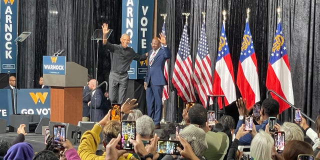 Former President Barack Obama joins Democratic Sen. Raphael Warnock of Georgia for a rally on Dec. 1, 2022 in Atlanta, Georgia. Warnock is facing off with Republican challenger Herschel Walker on Dec. 6 in a Senate runoff election. 