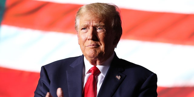 Former President Donald Trump greets supporters during a campaign rally at Minden-Tahoe Airport on October 08, 2022 in Minden, Nevada.