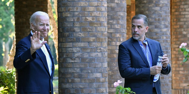 President Biden waves alongside his son Hunter Biden after attending mass at Holy Spirit Catholic Church in Johns Island, S.C., Aug. 13, 2022. 