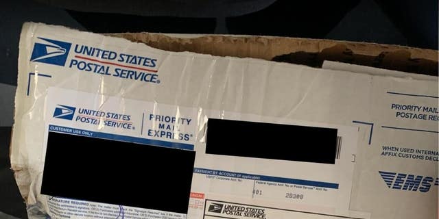 Photos of ripped packages containing donor checks allegedly stolen by U.S. Postal Service Workers. (Photo provided by Elise Stefanik for Congress.)