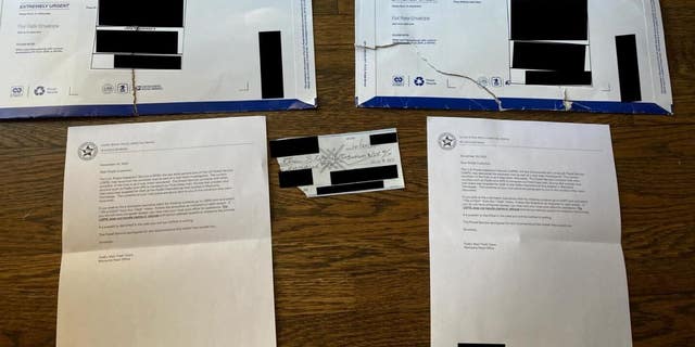 Photos of ripped packages containing donor checks allegedly stolen by U.S. Postal Service Workers. (Photo provided by Elise Stefanik for Congress.)