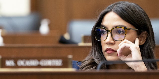 Rep. Alexandria Ocasio-Cortez, D-N.Y., attends a House Financial Services Committee hearing on Dec. 8, 2021.