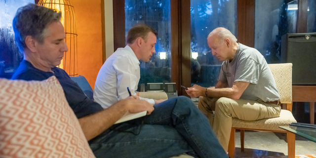 President Biden, right, talks on the phone with Polish President Andrzej Duda following an attack that killed two people in the eastern part of Poland near the Ukraine border as White House national security adviser Jake Sullivan, center, and Secretary of State Antony Blinken listen on Nov. 16, 2022.