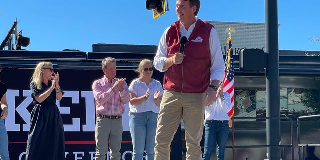 Republican Gov. Glenn Youngkin of Virginia speaks on behalf of GOP Gov. Brian Kemp of Georgia at a Kemp re-election rally on Sept. 27, 2022, in Alpharetta, Georgia