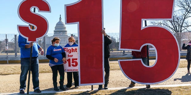 Activists appeal for a $15 minimum wage near the Capitol in Washington. (AP Photo/J. Scott Applewhite)