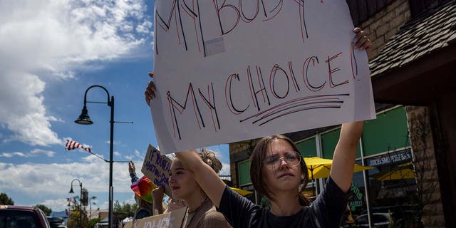 FILE: A group of teenagers protests the Supreme Court's decision in the Dobbs v Jackson Women's Health case on July 2, 2022 on the main street in Driggs, Idaho. 