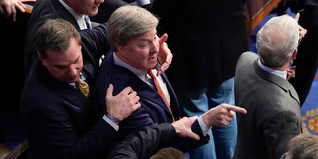 Rep. Richard Hudson, R-N.C., intervenes to stop Rep. Mike Rogers, R-Ala., in the U.S. Capitol Building, in Washington D.C., Friday, Jan. 6, 2023. 