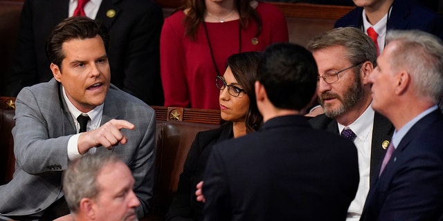 Rep. Matt Gaetz, R-Fla., talks to Rep. Kevin McCarthy, R-Calif., after Gaetz voted "present" in the House chamber as the House meets for the fourth day to elect a speaker and convene the 118th Congress in Washington, Friday, Jan. 6, 2023. 