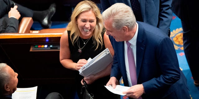 Rep. Marjorie Taylor Greene, R-Ga., left, speaks with House Minority Leader Kevin McCarthy, R-Calif., as the House votes on creating a January 6th Committee at the U.S. House Chamber of the U.S. Capitol in Washington on Wednesday, June 30, 2021. (Photo by Caroline Brehman/CQ-Roll Call, Inc via Getty Images) 