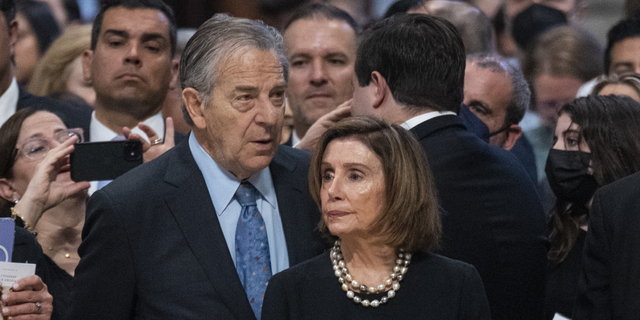 Nancy Pelosi, left, with her husband Paul Pelosi attend a Holy Mass for the Solemnity of Saints Peter and Paul lead by Pope Francis in St. Peter's Basilica, on June 29, 2022.