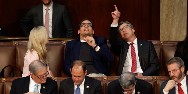 From left: U.S. Rep.-elect Marjorie Taylor Greene, R-Ga.; Rep.-elect George Santos, R-N,Y.; and Rep.-elect Andy Ogles, R-Tenn., talk in the House Chamber during the third day of elections for speaker of the House at the U.S. Capitol Building in Washington, D.C., on Jan. 5, 2022. 