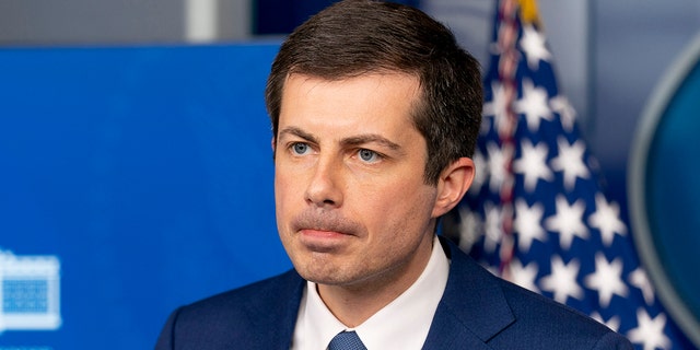 Transportation Secretary Pete Buttigieg takes a question from a reporter at a press briefing at the White House April 9, 2021, in Washington.