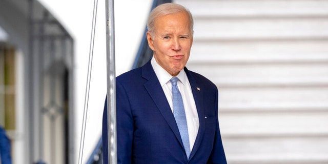 President Joe Biden walks toward members of the media before boarding Marine One on the South Lawn of the White House in Washington, Friday, Feb. 24, 2023, for travel to Wilmington, Delaware.