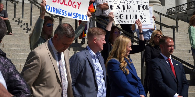 Lawmakers listen as parents speak about the prospect of their children competing against transgender girls in school sports at the Utah State Capitol.