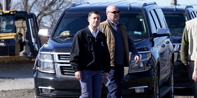 Transportation Secretary Pete Buttigieg arrives for a news conference Thursday, Feb. 23, 2023, near the site of the Feb. 3 Norfolk Southern train derailment in East Palestine, Ohio. (AP Photo/Matt Freed)