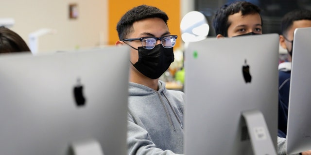 Students in the Exploring Computer Science class listen to Superintendent Alberto M. Carvalho, Los Angeles Unifed School District, while Carvalho tours Maywood Center For Enriched Studies Magnet school, Feb. 16, 2022, in Maywood, California.