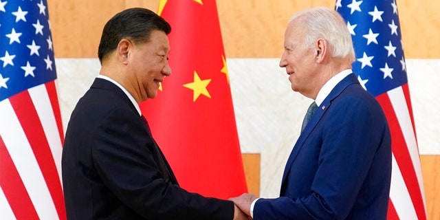 President Biden, right, and Chinese President Xi Jinping shake hands before their meeting on the sidelines of the G20 summit meeting, Nov. 14, 2022, in Nusa Dua, in Bali, Indonesia.