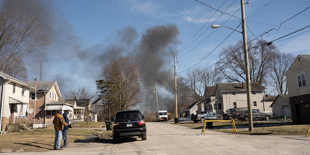 Smoke rises from a derailed cargo train in East Palestine, Ohio, on February 4, 2023. 