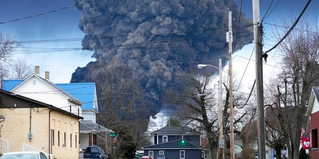 A large plume of smoke rises over East Palestine, Ohio, after a controlled detonation of a portion of the derailed Norfolk Southern trains Monday, Feb. 6, 2023. About 50 cars, including 10 carrying hazardous materials, derailed in a fiery crash. Federal investigators say a mechanical issue with a rail car axle caused the derailment. 
