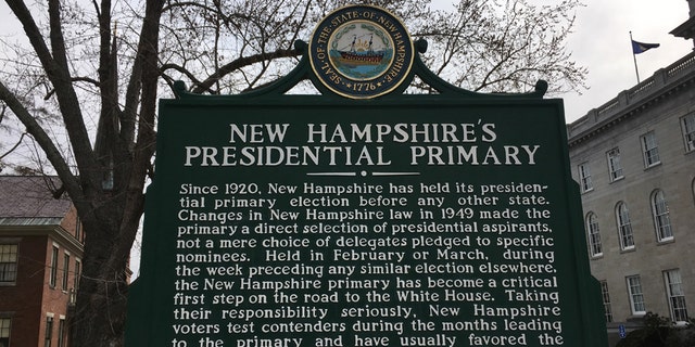 A sign outside the New Hampshire Statehouse in Concord, N.H. marks the state's cherished first-in-the-nation presidential primary.