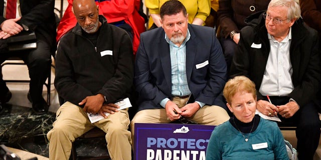 Members of the Faith and Family advocacy group, listen to speakers during a rally in the rotunda of the Kentucky State Capitol in Frankfort, Ky., Thursday, Feb. 16, 2023.