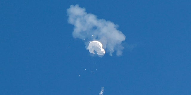 The suspected Chinese spy balloon drifts to the ocean after being shot down off the coast in Surfside Beach, South Carolina, Feb. 4, 2023.