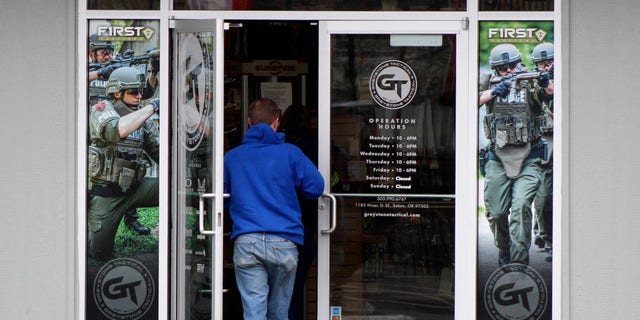 A man enters a gun shop in Salem, Oregon, on Feb. 19, 2021.