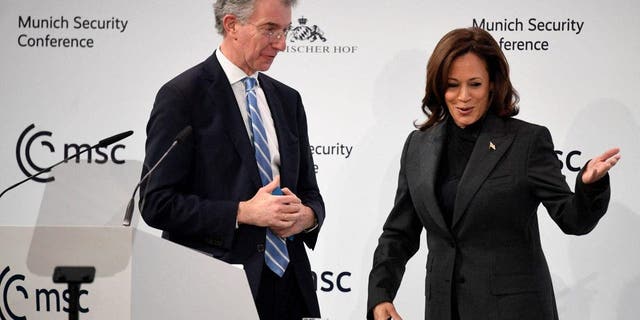 US Vice President Kamala Harris stands on stage with the Chairman of the Munich Security Conference (MSC) Christoph Heusgen at the Munich Security Conference (MSC) in Munich, southern Germany, on February 18, 2023. - The Munich Security Conference running from February 17 to 19, 2023 brings world leaders together ahead of the first anniversary of Russia's invasion of Ukraine as Kyiv steps up pleas for more weapons. 