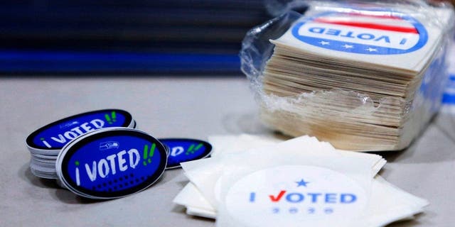 "I voted" stickers with the Seahawks logo are pictured on Election Day at a voting center set up at the CenturyLink Field Event Center for people that need to register or get other assistance in the vote-by-mail state in Seattle Nov. 3, 2020.