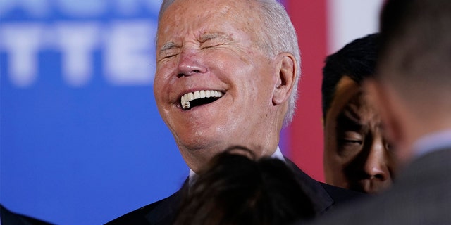 President Joe Biden laughs as he greets people after speaking about his infrastructure plan and his domestic agenda during a visit to the Electric City Trolley Museum in Scranton, Pa., Wednesday, Oct. 20, 2021.