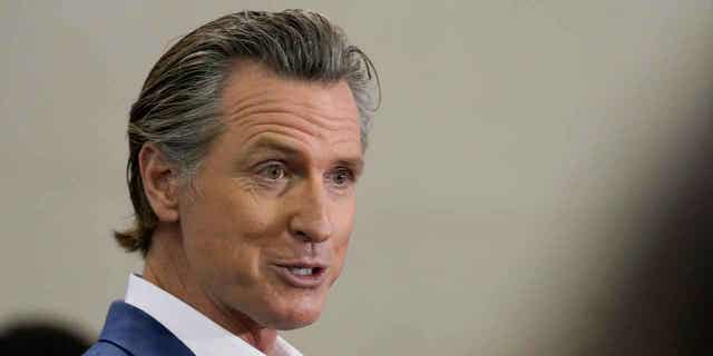 California Gov. Gavin Newsom speaks at a news conference in Sacramento, California, on March 16, 2023. On March 30, 2023, Newsom announced a new political action committee he claims will boost Democrats in Republican-led states. 