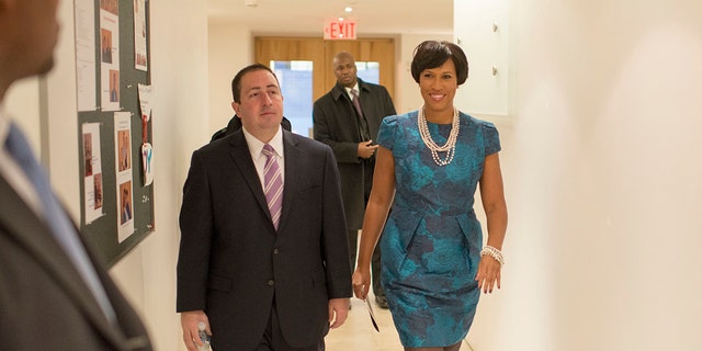 Mayor Muriel Bowser, seen accompanied by John Falcicchio in 2015 following her election to office, announced an investigation into her former adviser. 