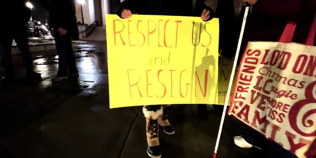 Protest sign outside Framingham city hall calling for Michael Hugo to resign following his controversial comments on abortion.