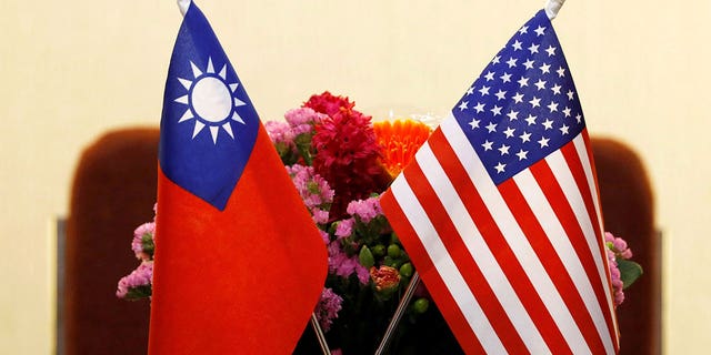Flags of Taiwan and U.S. are placed for a meeting in Taipei, Taiwan March 27, 2018.