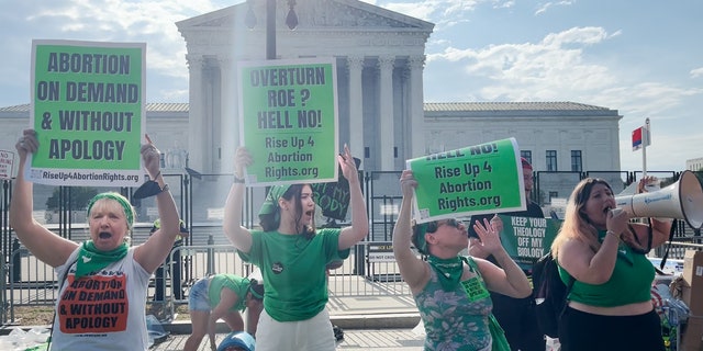 Law enforcement separated pro-choice and pro-life protesters outside the Supreme Court