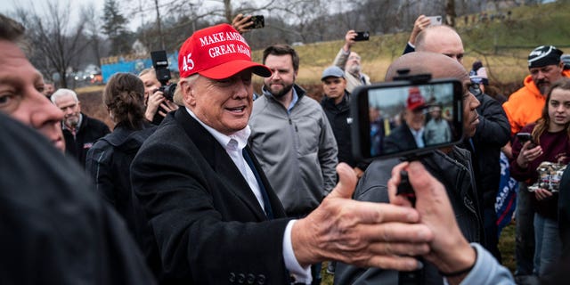Former President Donald Trump greets supporters during a visit to East Palestine, Ohio, following the Feb. 3 Norfolk Southern freight train derailment, on Feb. 22, 2023.