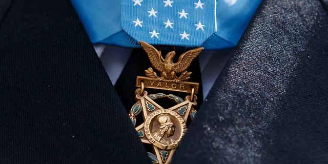 The Medal of Honor is seen around the neck of Medal of Honor recipient Army Staff Sgt. David Bellavia outside the West Wing of the White House in Washington, June 25, 2019. One of the first Black officers to lead a Special Forces team in combat will receive the Medal of Honor, the nation's highest award for bravery on the battlefield, nearly 60 years after he distinguished himself during the Vietnam War. President Joe Biden telephoned ret. U.S. Army Col. Paris Davis on Monday, Feb. 13, 2023, "to inform him that he will receive the Medal of Honor for his remarkable heroism during the Vietnam War." (AP Photo/Carolyn Kaster, File)
