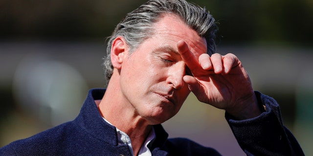California Gov. Gavin Newsom pauses during a news conference after touring Barron Park Elementary School on March 2, 2021 in Palo Alto, Calif.